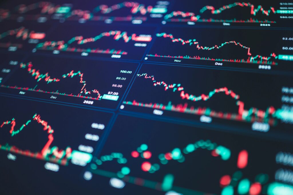 advanced financial data stream glowing red, green, and blue charts depicting real-time economic indicators for strategic insights